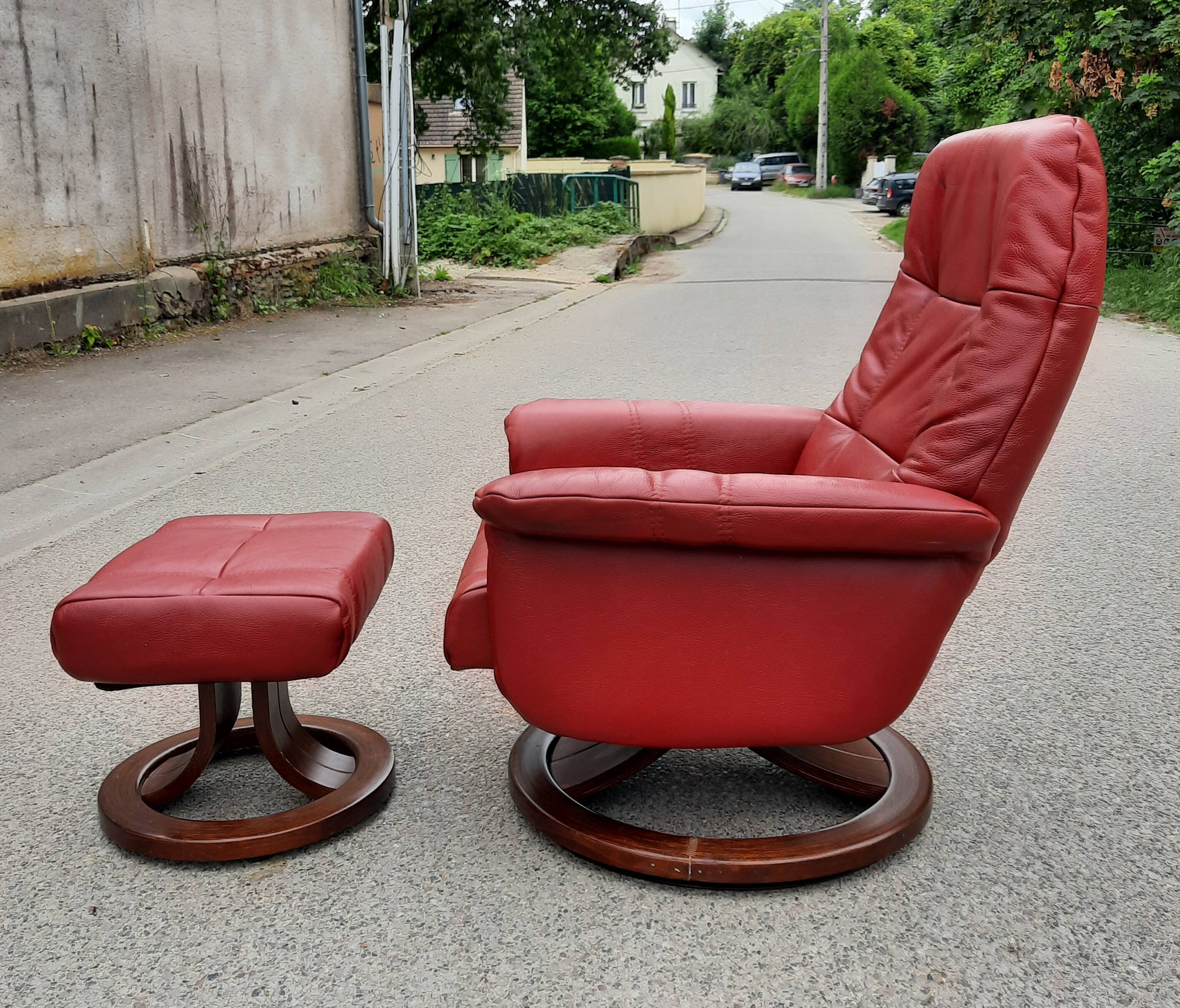 Red leather relax armchair and pouf