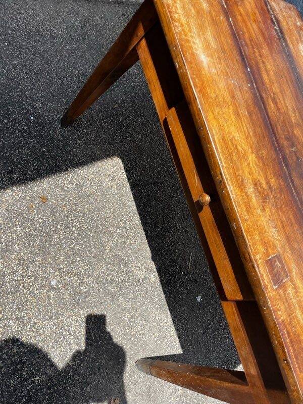 Old wooden table with a drawer