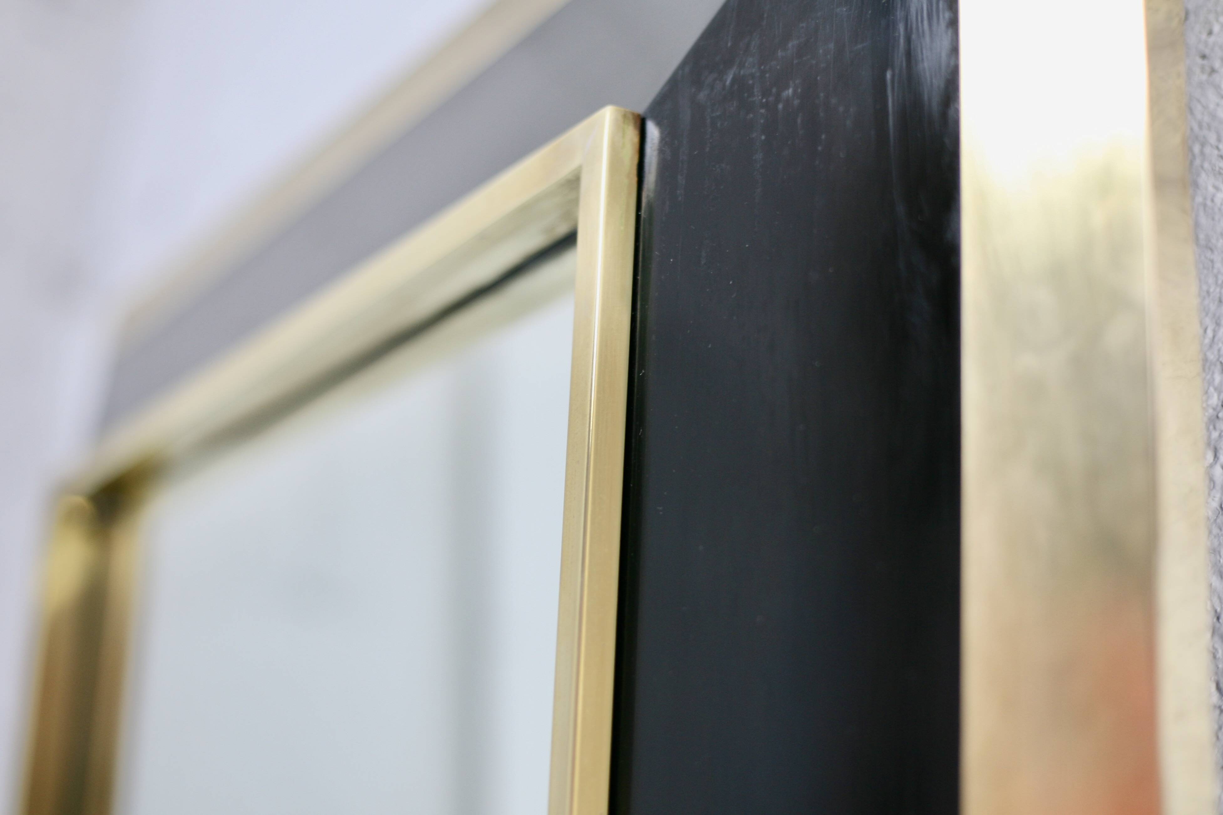 Jean-Claude Mahey mirror. Black lacquered wood and gold metal. 1970