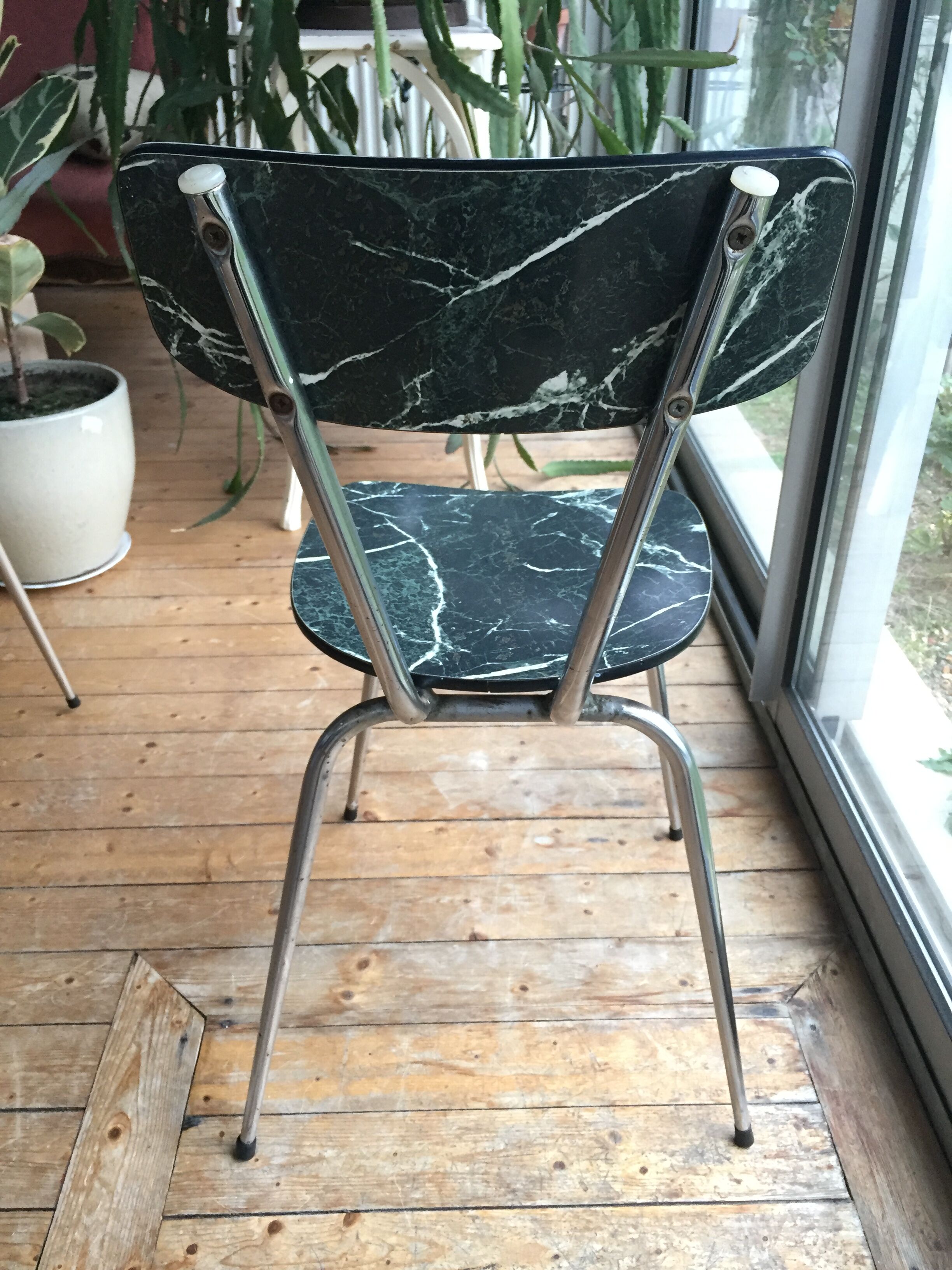 4 chairs in very dark green formica marble effect