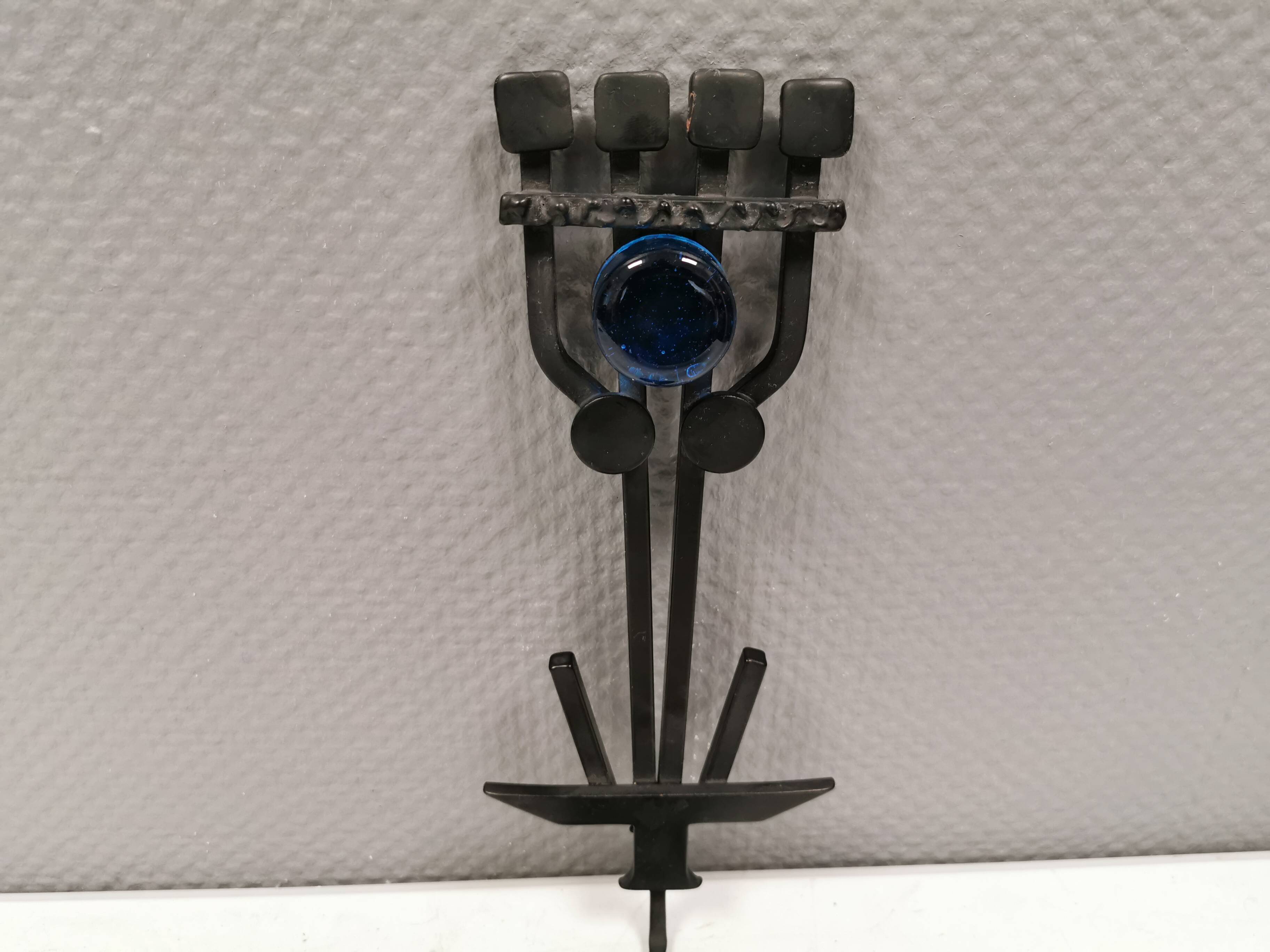 Vintage wall candle holder in wrought iron and hard pressed blue glass.