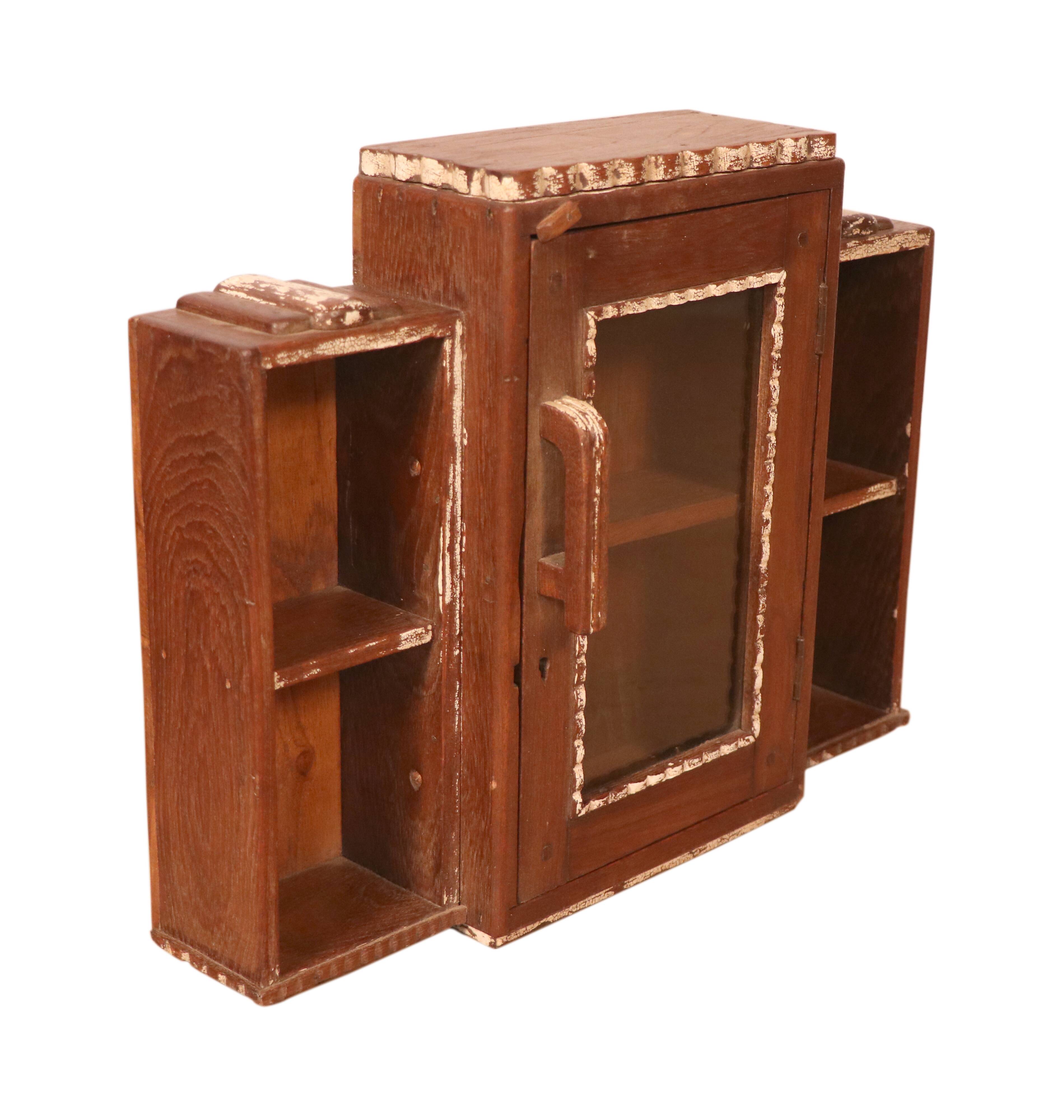 Old art deco showcase in burmese teak with original white edging