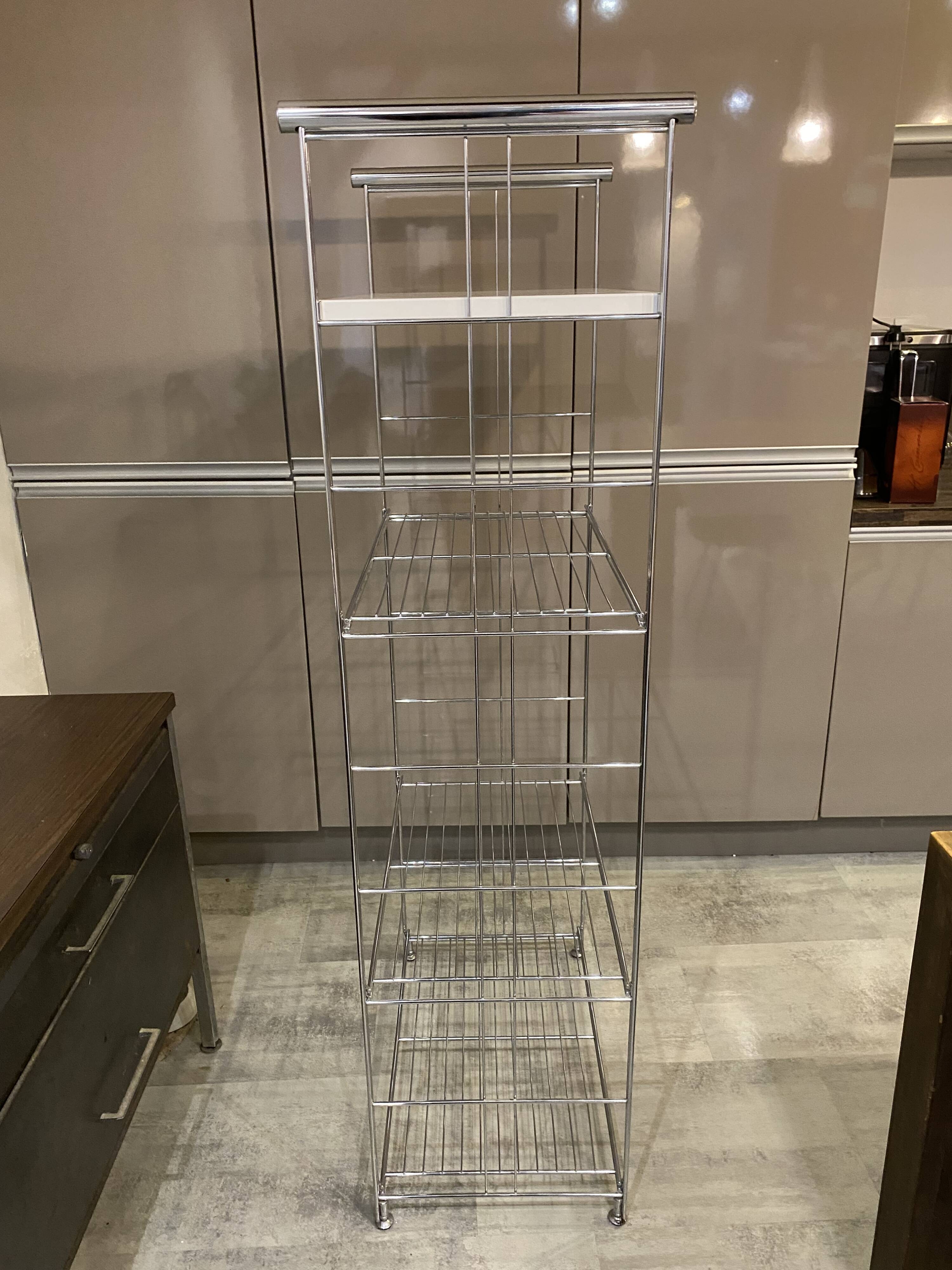 Modular wall bookshelf desk in vintage chrome.