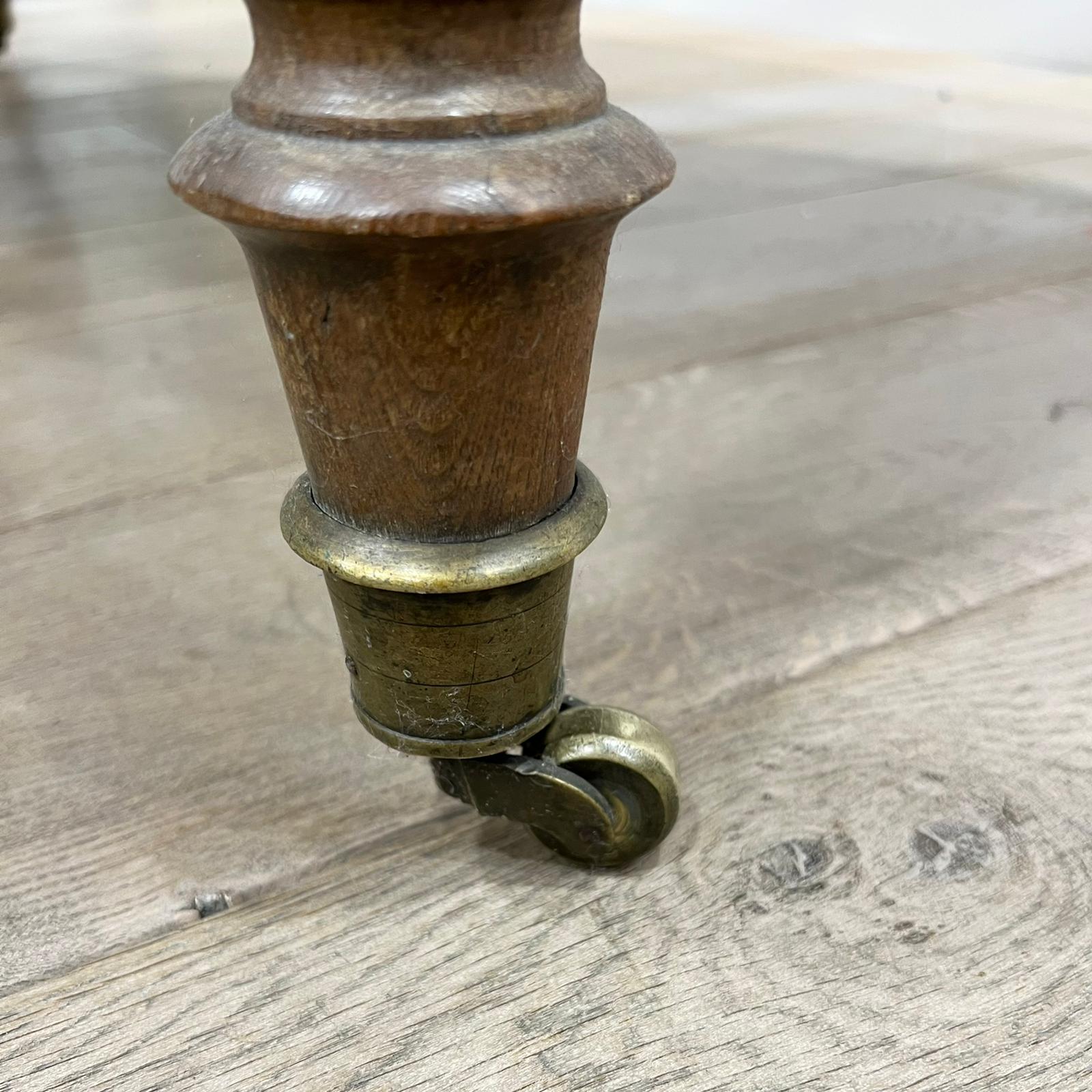 Louis Philippe wood dining table with shutters and casters