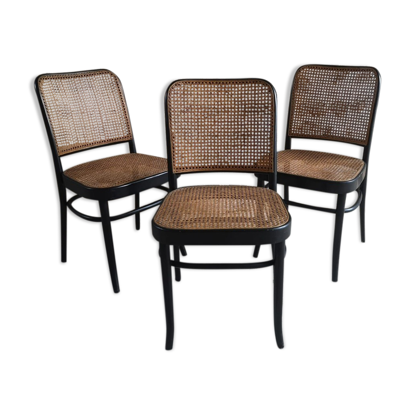 Blackened wooden chairs and cannage around 1980