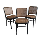 Blackened wooden chairs and cannage around 1980