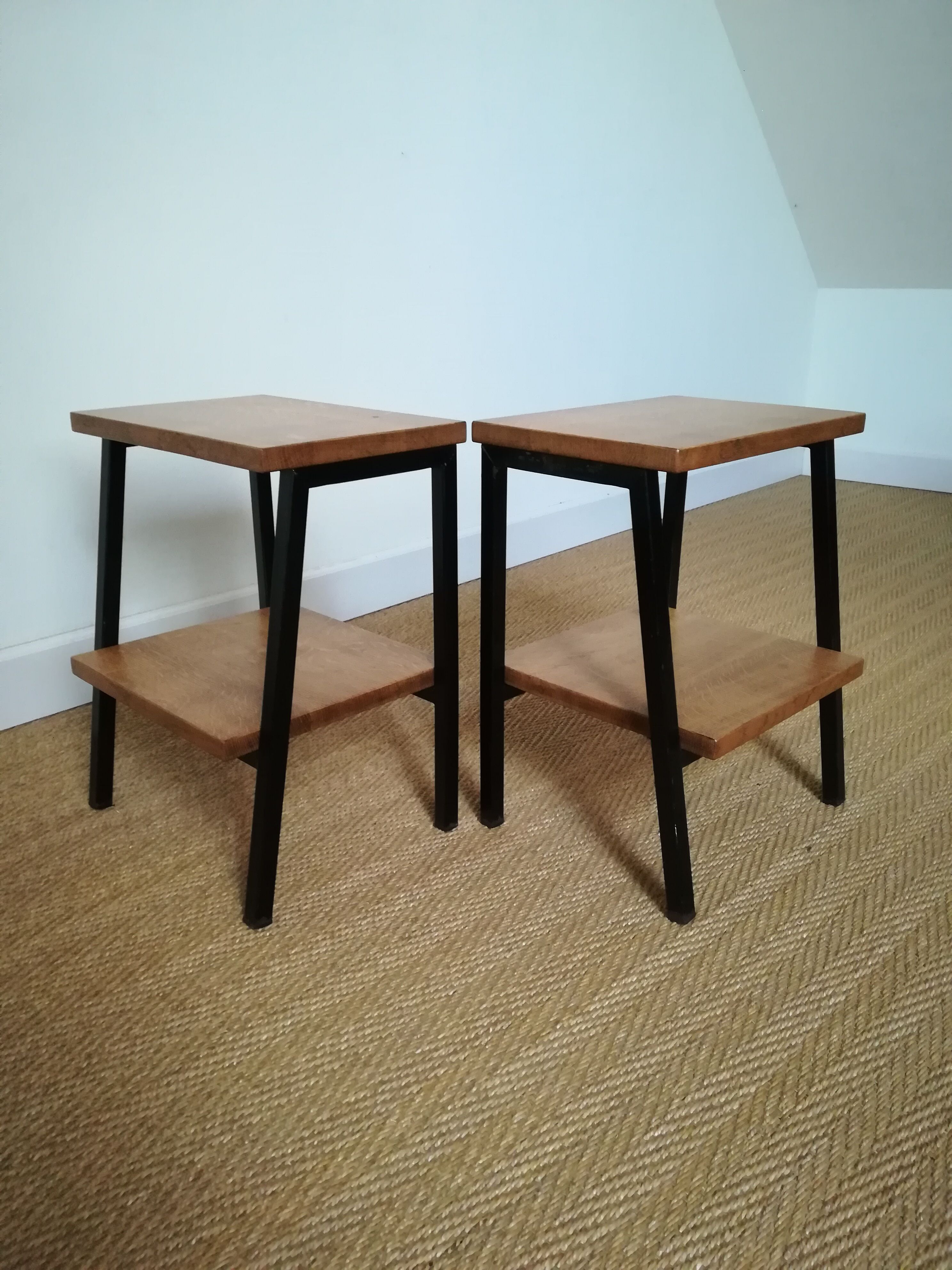 A pair of bedside tables