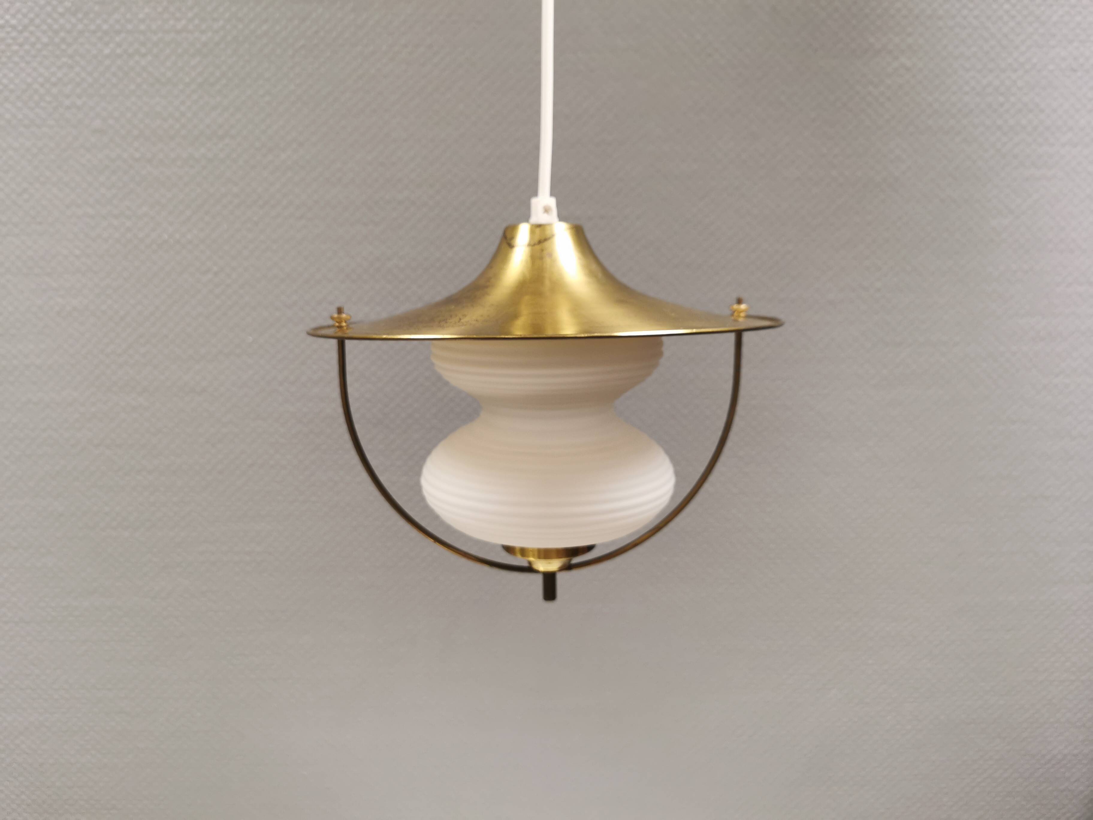 Beautiful older hanging lamp in brass and milky white glass. Germany 1950s