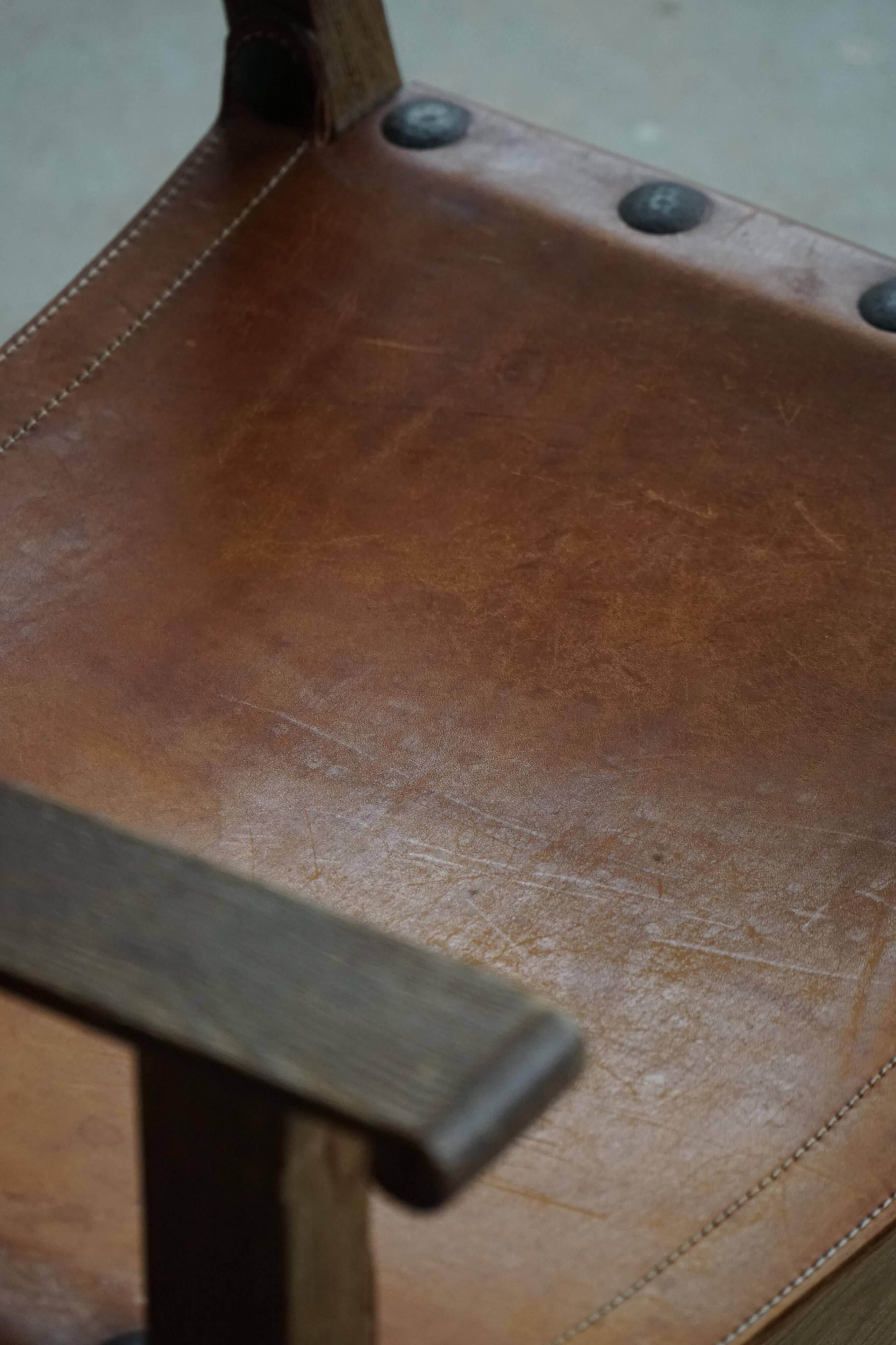 Pair of Spanish brutalist armchairs from the 1960s, wood and leather.