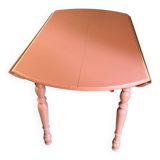 Round wooden table with folding sides