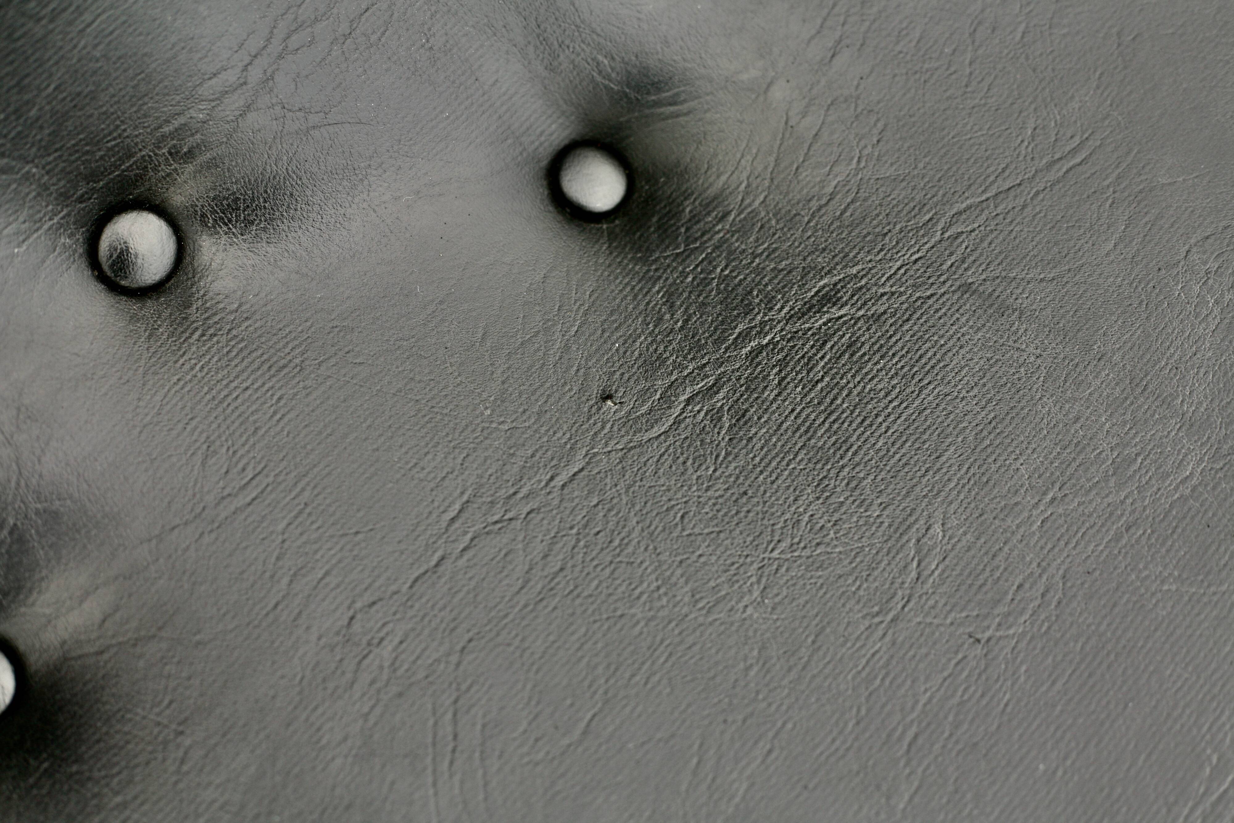 Pair of “space age” low chairs. Black faux leather. Circa 1970