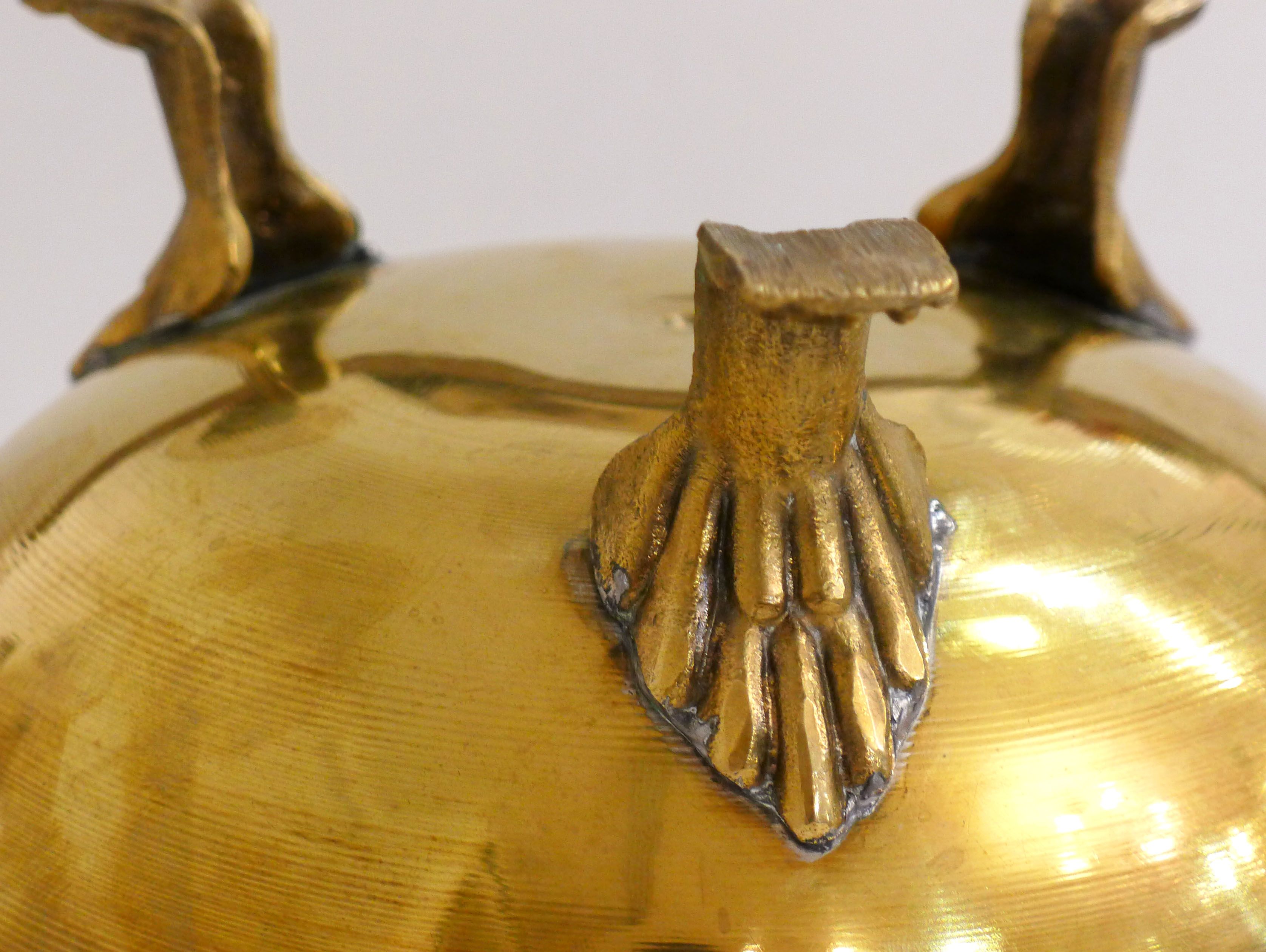 Planter on lion legs, made of golden metal