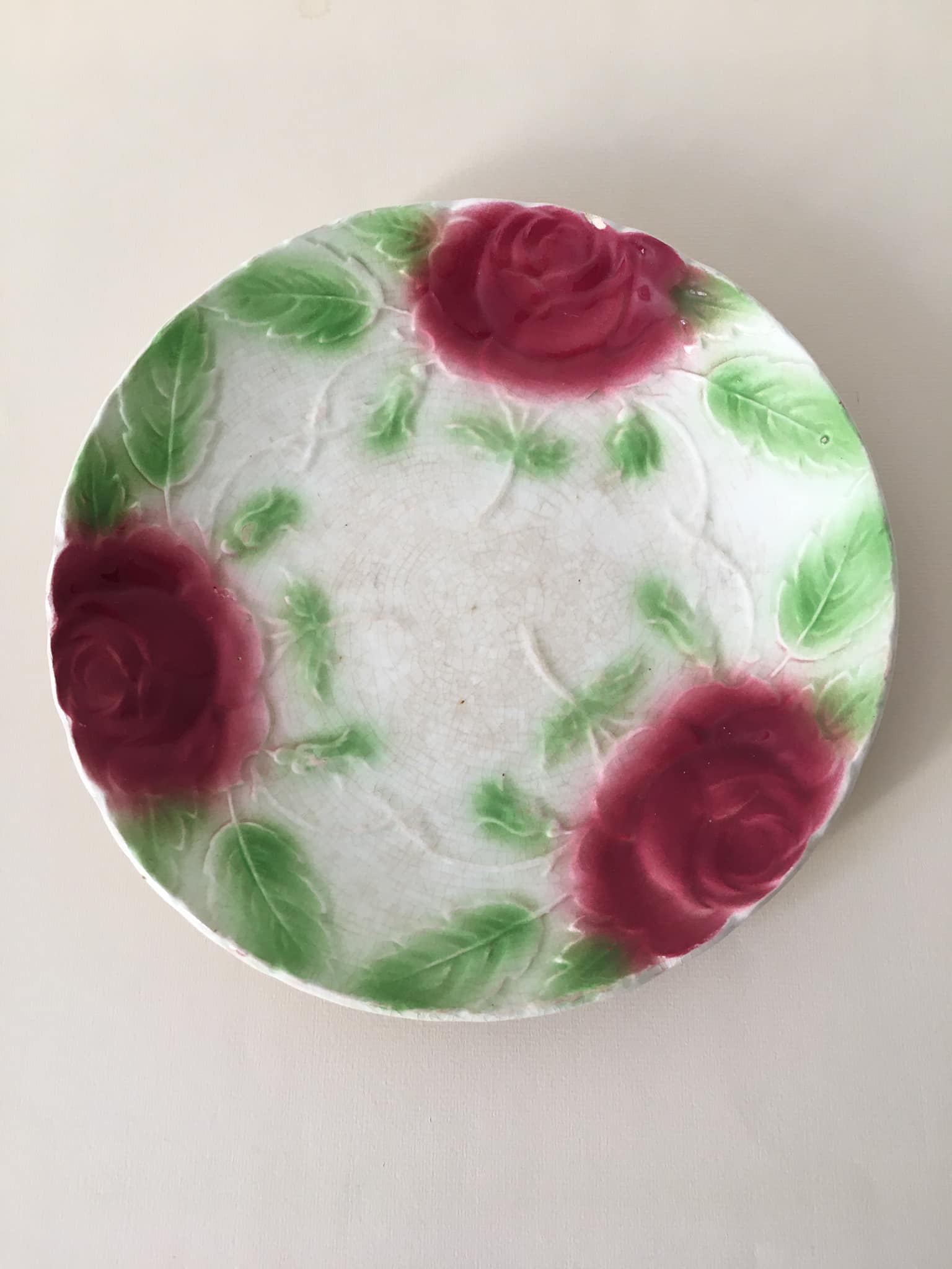 Old slip plate decorated with Majolica roses