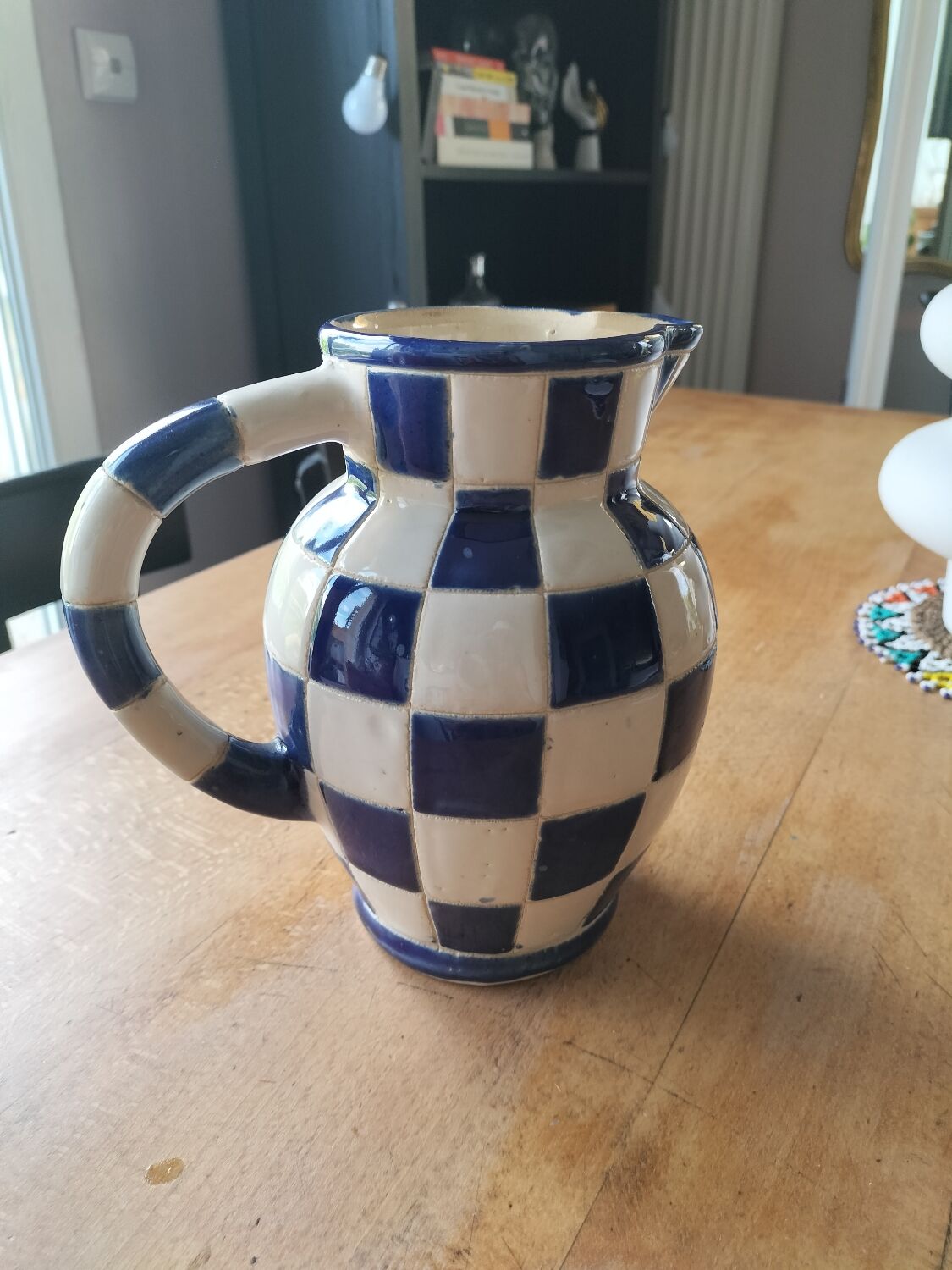 Blue and white checkerboard water pitcher