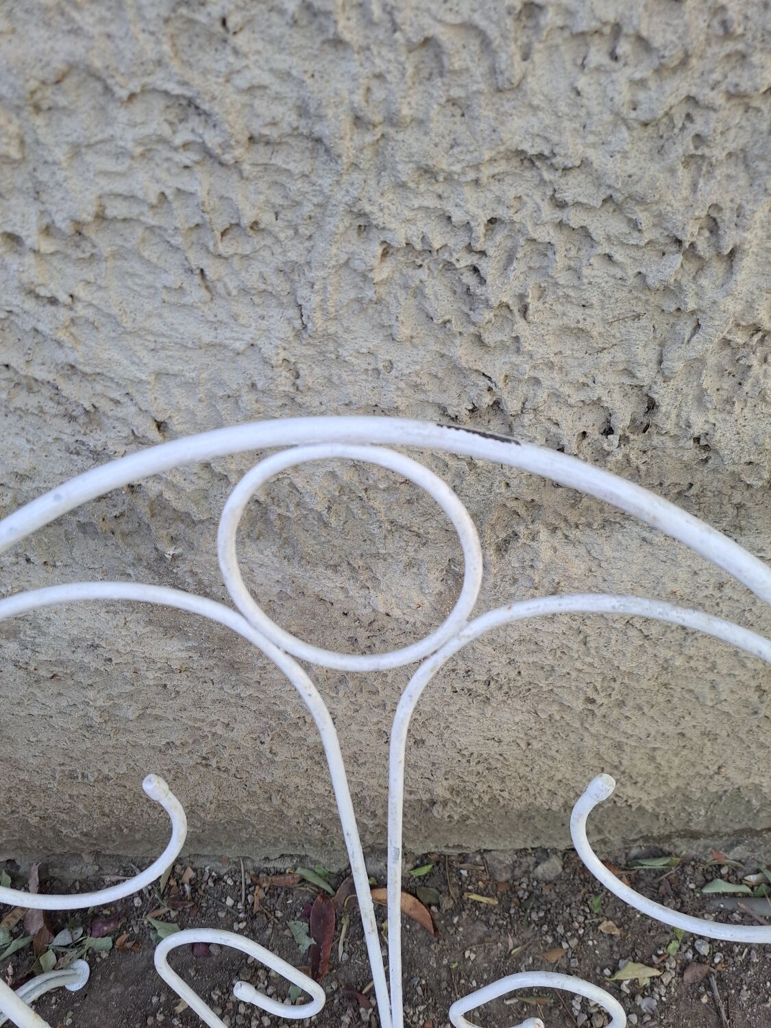 Pair of old white iron armchairs