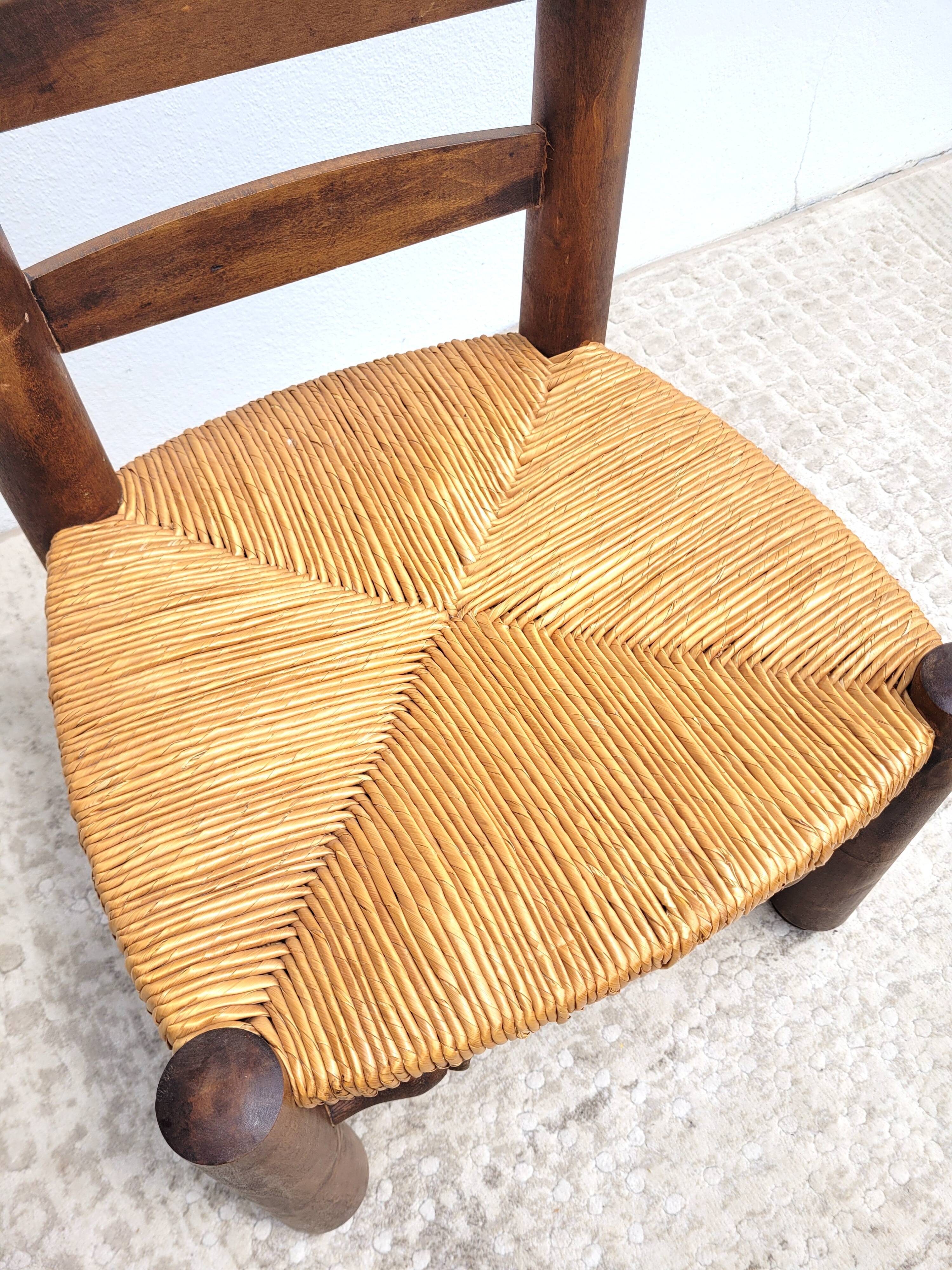 Low chair in turned wood and straw