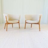 Mid-century lounge chairs in sheepskin/shearling and stained wood, Sweden, 1962.