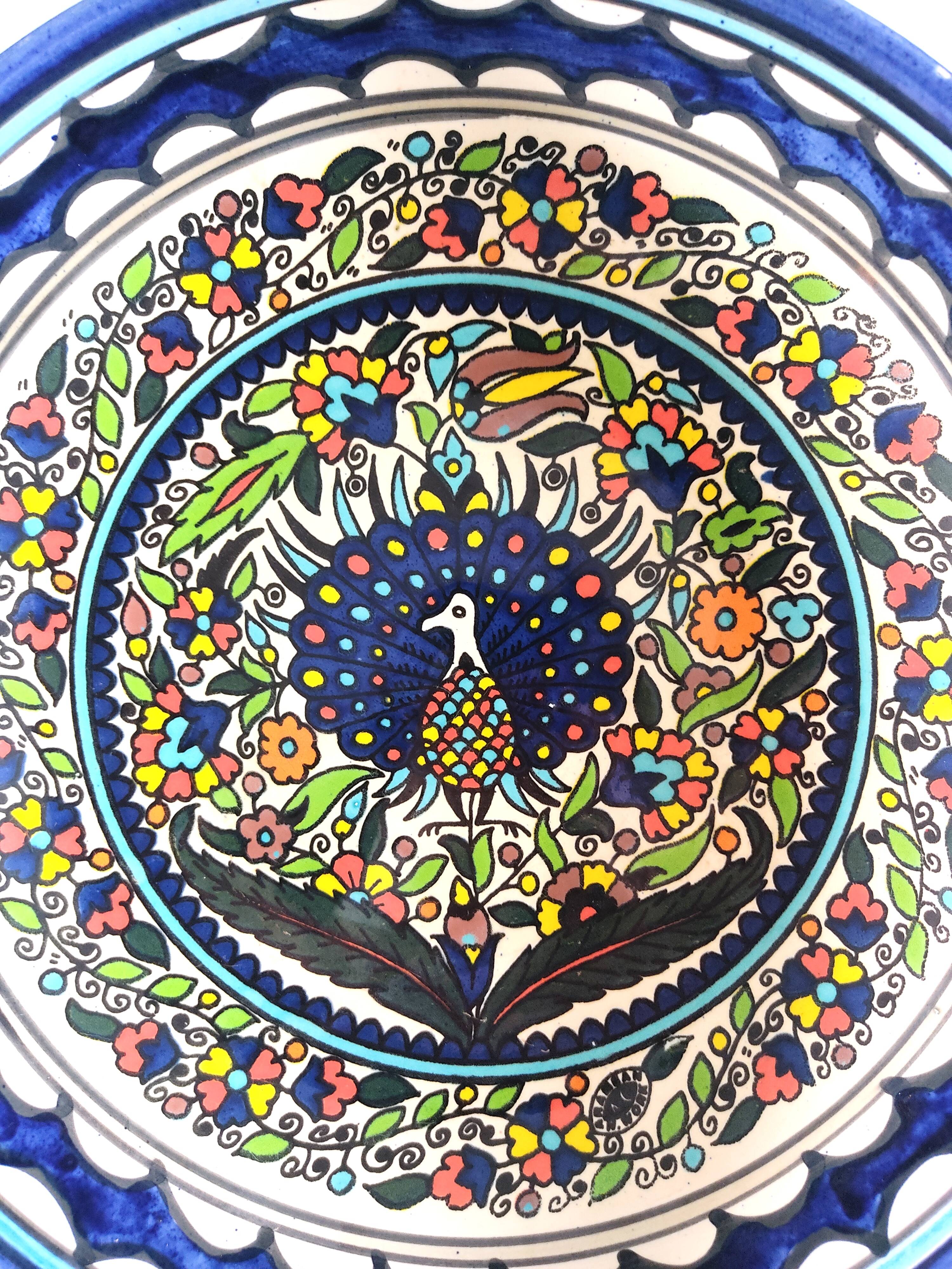 Large decorative dish with colorful peacock