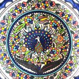 Large decorative dish with colorful peacock