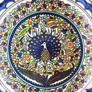 Large decorative dish with colorful peacock
