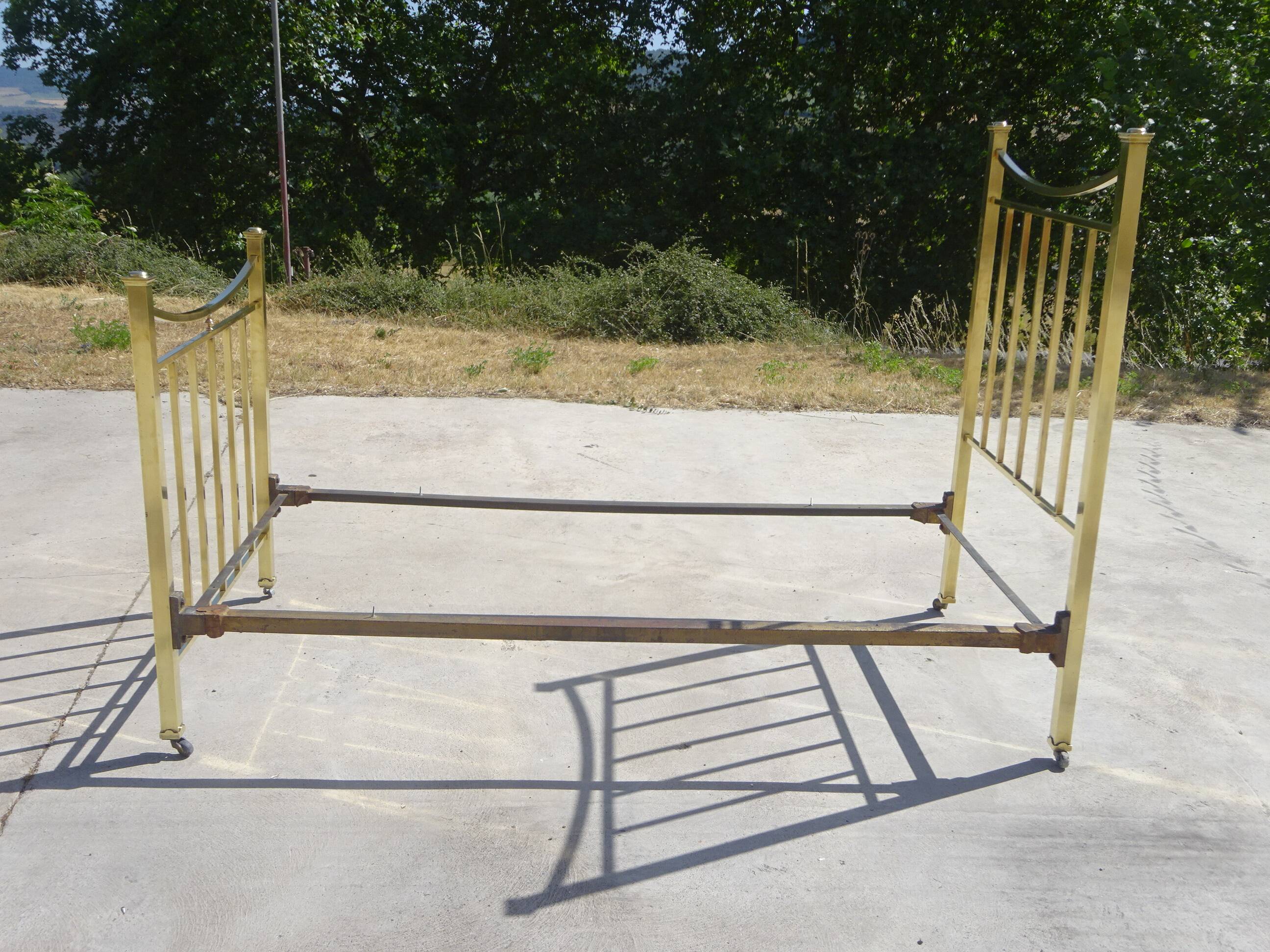 Antique gold-plated brass bed for one person.