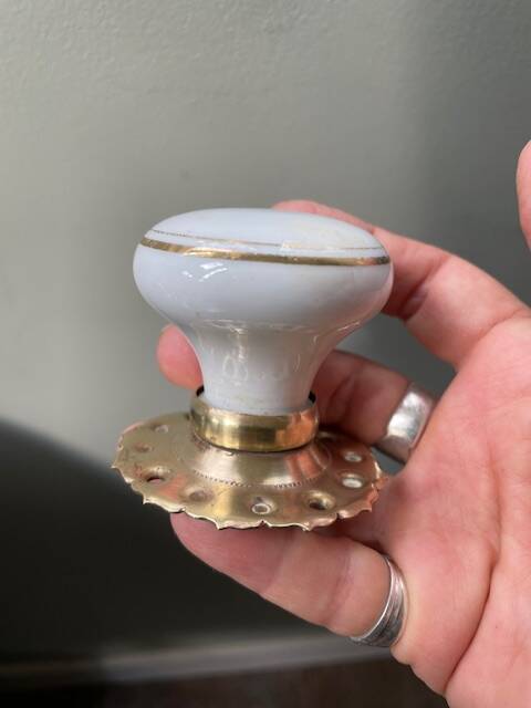 pair of round porcelain and copper Art Deco handles