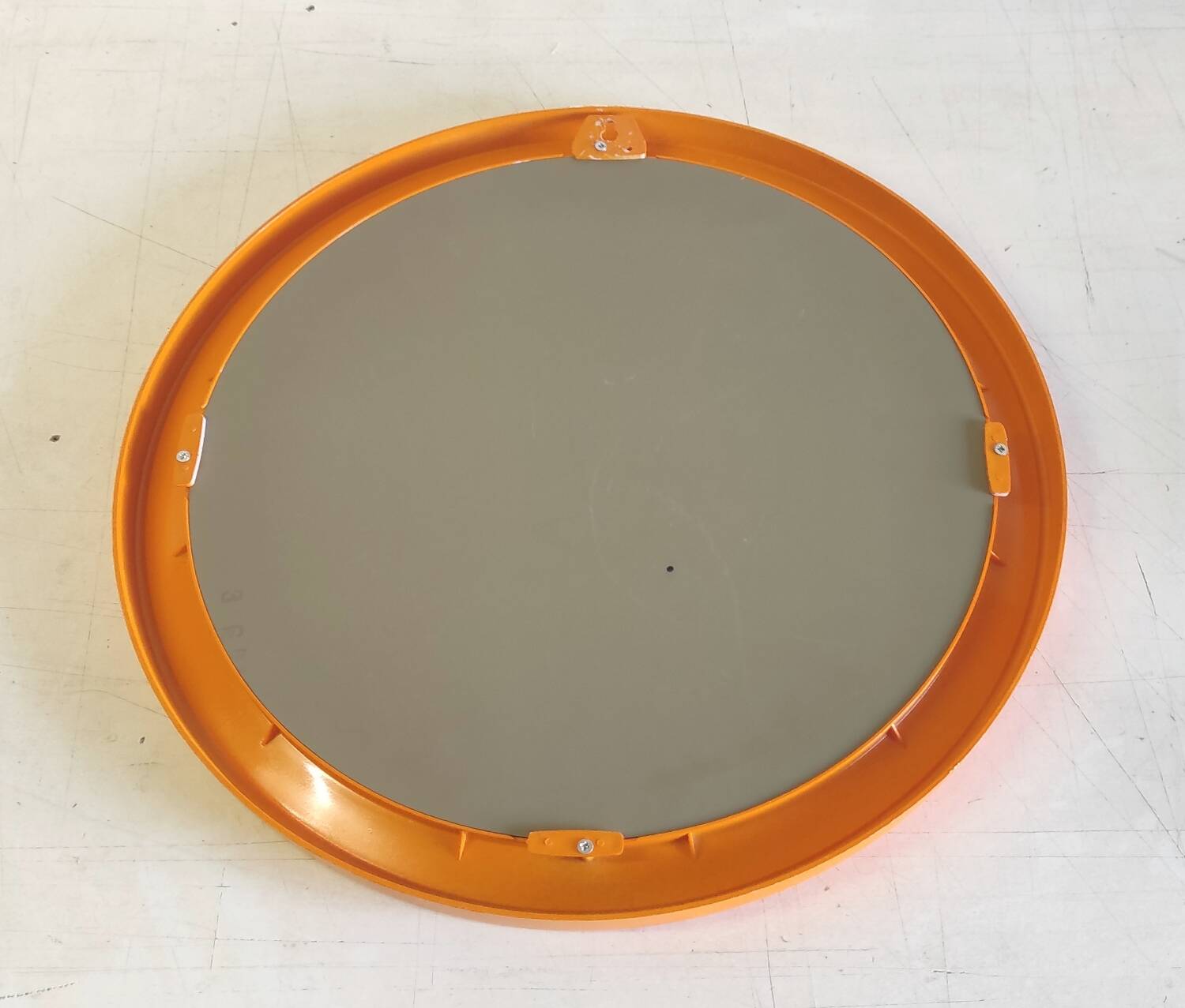 Round orange plastic mirror - 1970s