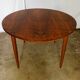 Round rosewood table with extension from the 70s