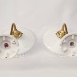 Swan neck sconces in serrated opaline