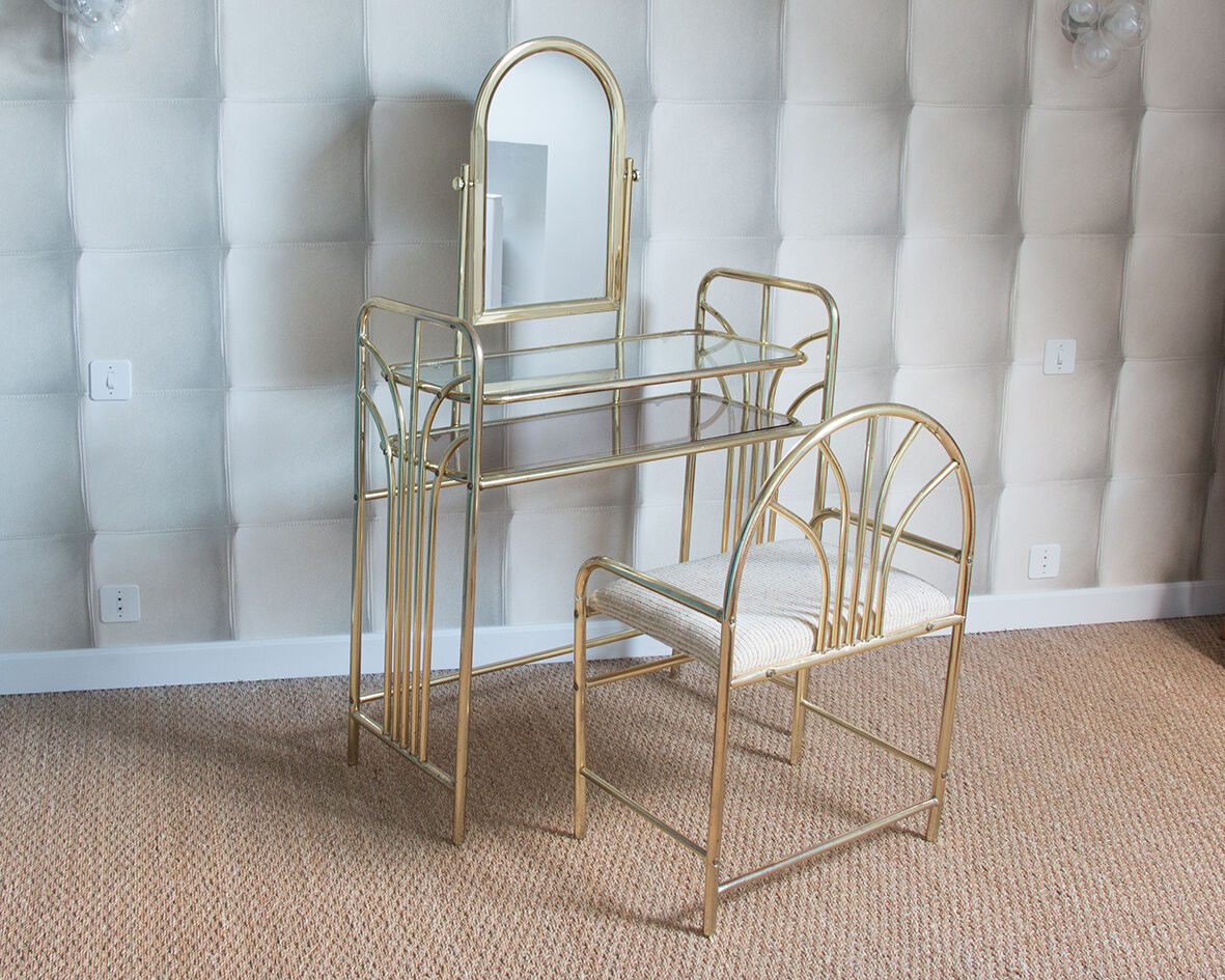 Dressing table in gold metal