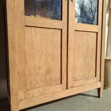 Large antique display cabinet in patinated solid oak.