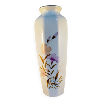 White ceramic vase with floral patterns