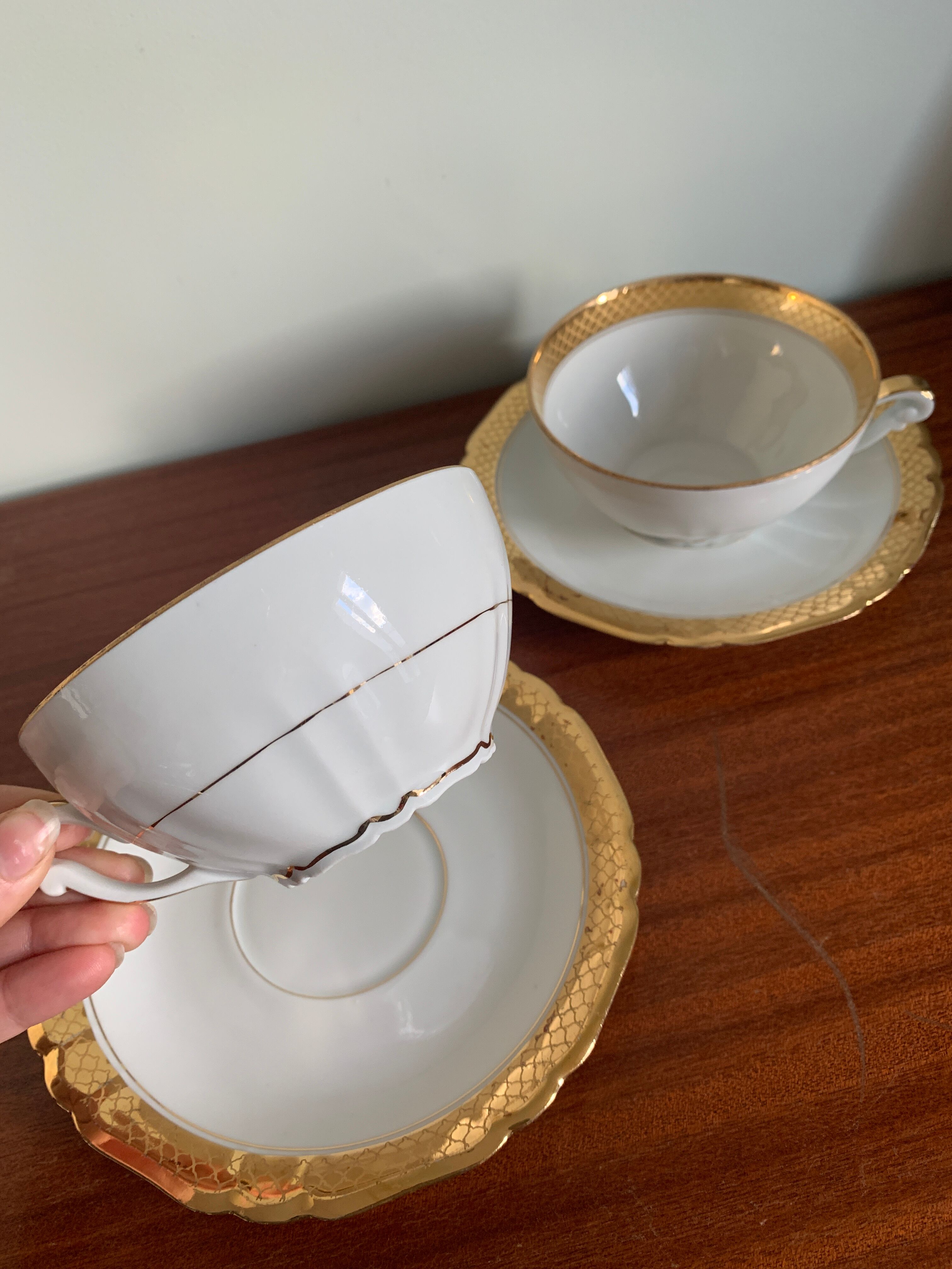 Pair of gold porcelain tea cups