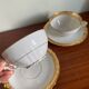Pair of gold porcelain tea cups