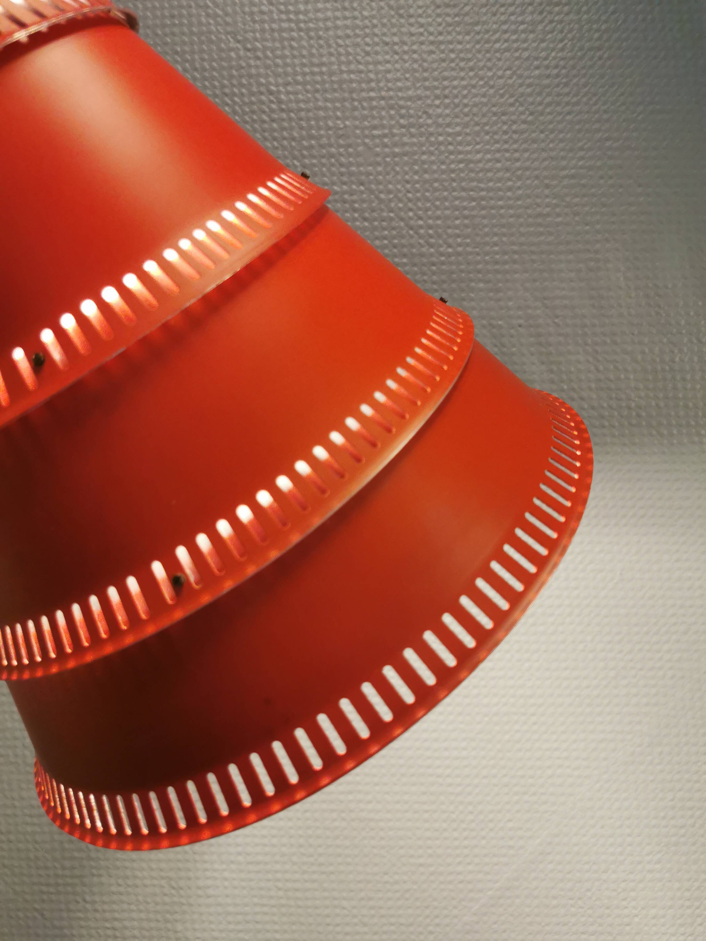 Knud Hjerting Metal layered cone-shaped hanging lamp with perforated detail on the edge. Model P208