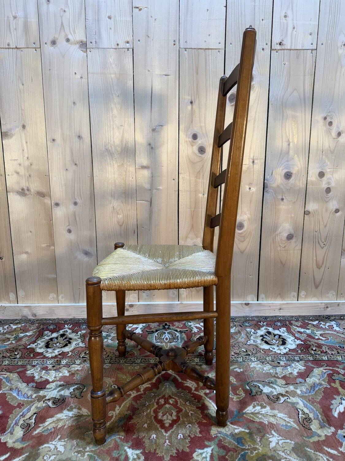 Set of 8 rustic high-back straw chairs.