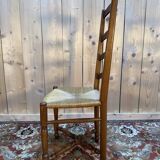 Set of 8 rustic high-back straw chairs.