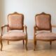 Pair of cabriolet armchairs in Louis XV style in light walnut.