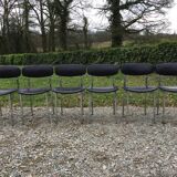 6 vintage chairs in black skaï with chrome metal tubular base.
