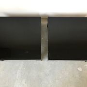 Pair of black laqué wood coffee tables, circa 1970.