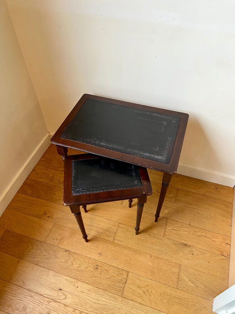Dark wood and black leather tables