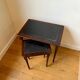 Dark wood and black leather tables
