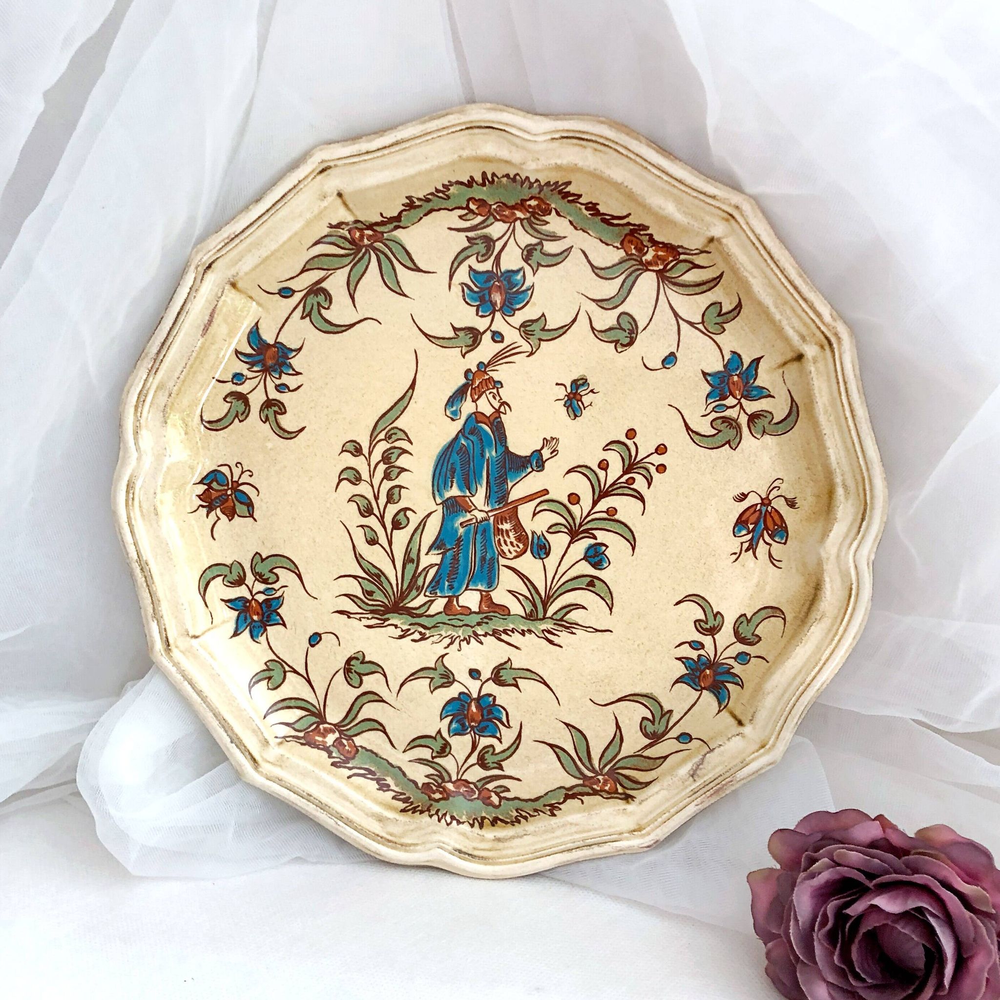 Decorative earthenware plate from Salins France, Moustiers decor, 25.5 cm