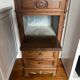 Solid wood storage furniture with a marble top.