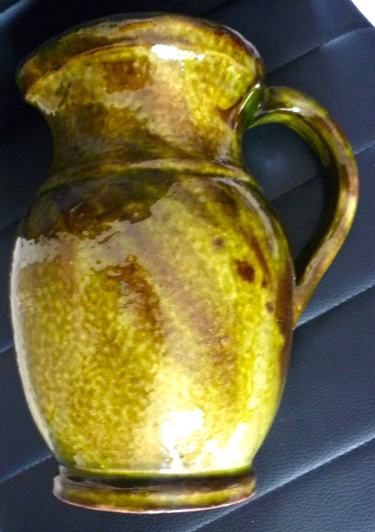 Pitcher vase, thick green glazed terracotta, signature to be identified