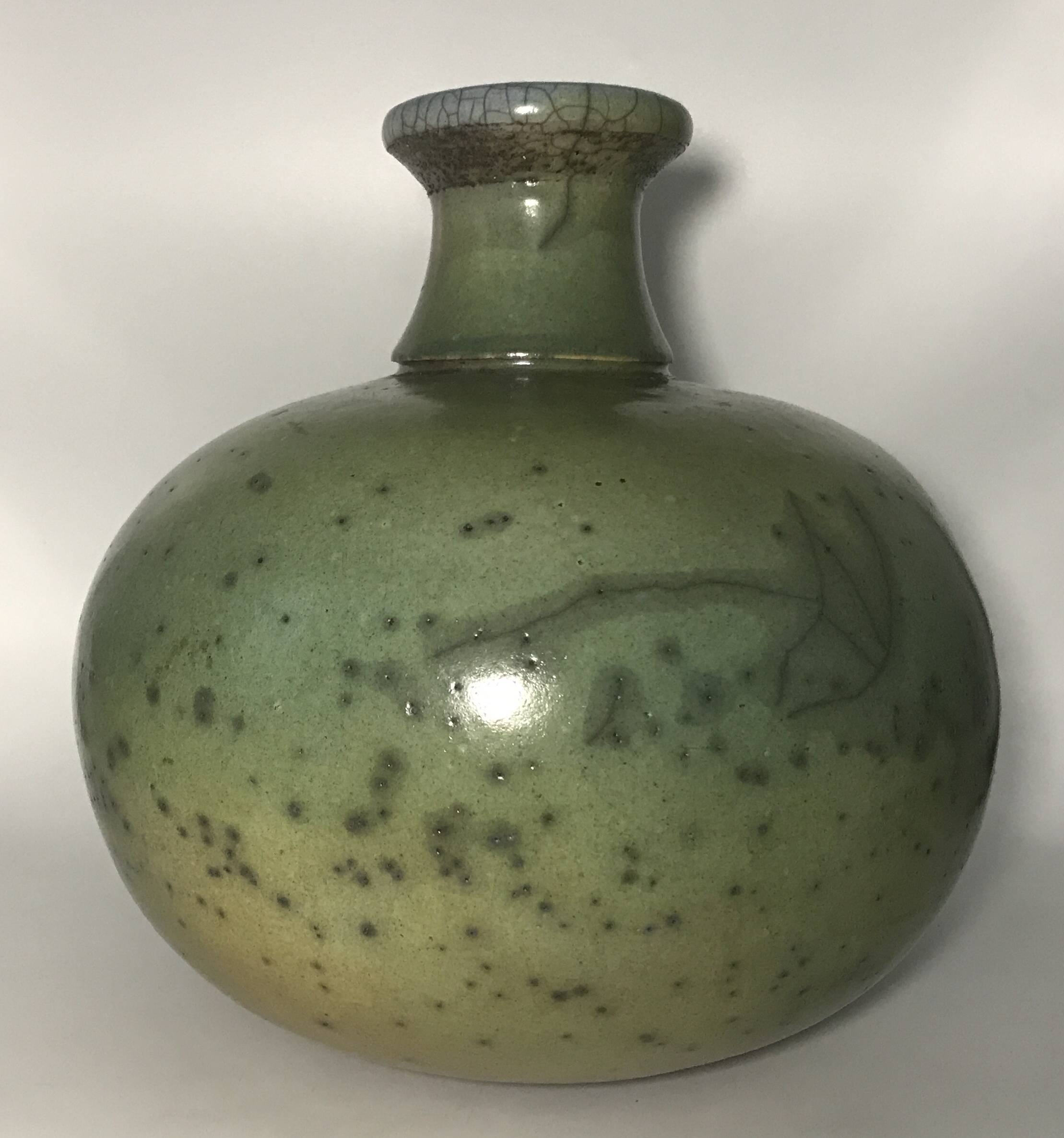 Contemporary vase ball shape raku shades of green and yellow