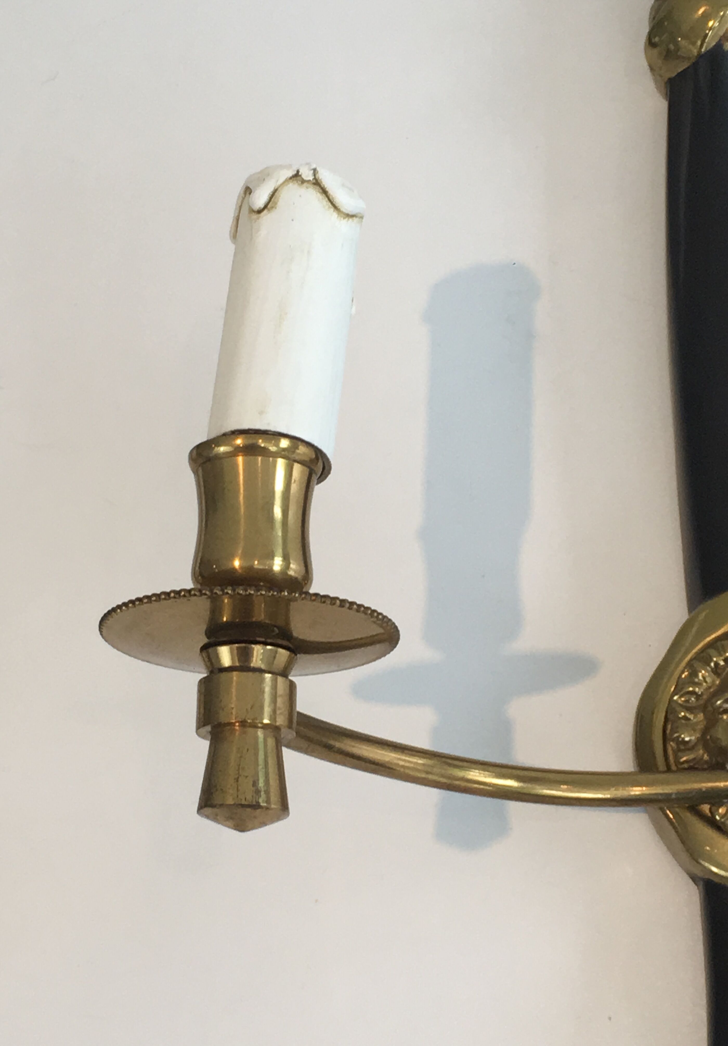 Pair of Black Lacquered Bronze Wall Lamps with Lions' Head Decorations. Around 1970