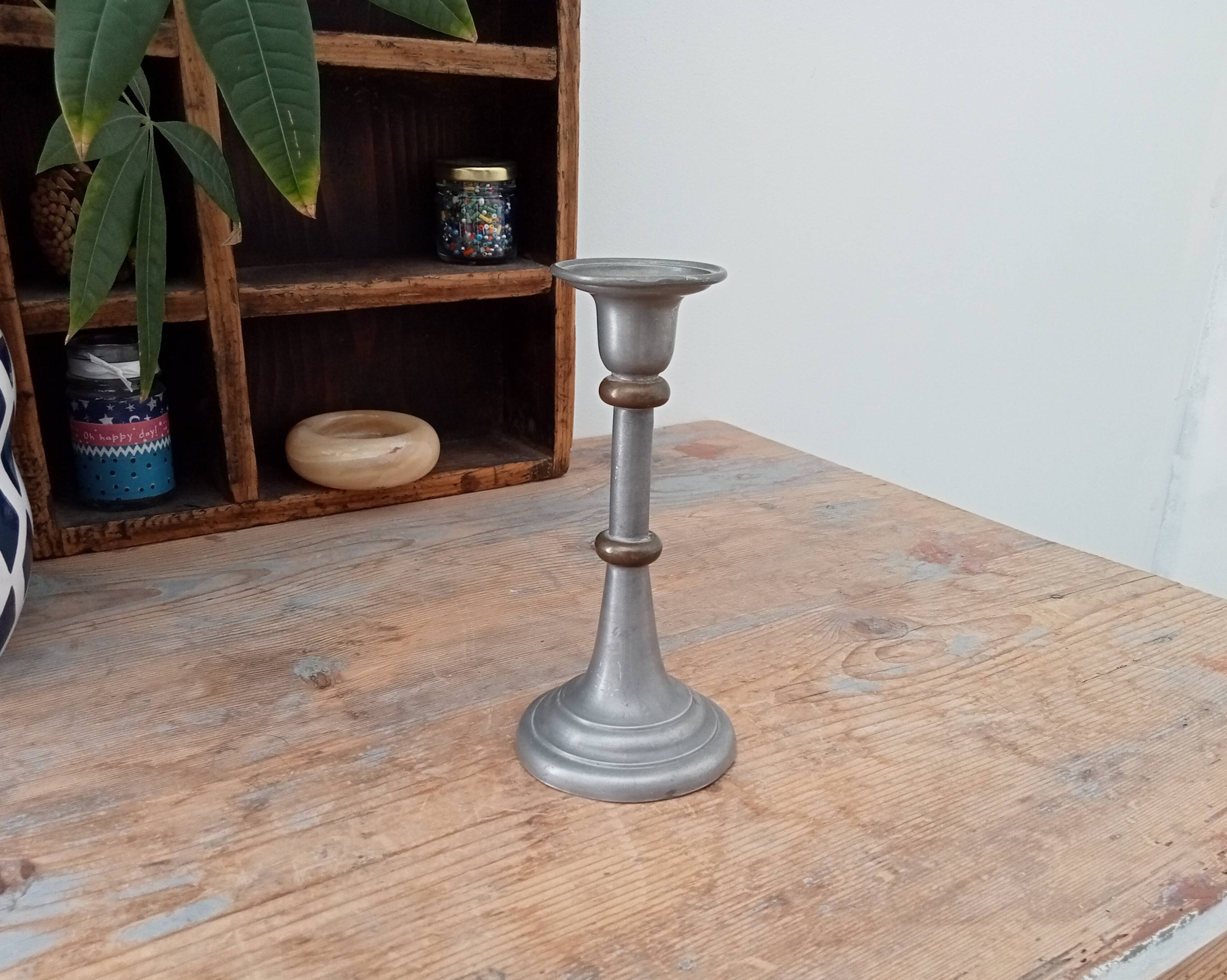 Antique candle holder in pewter and brass