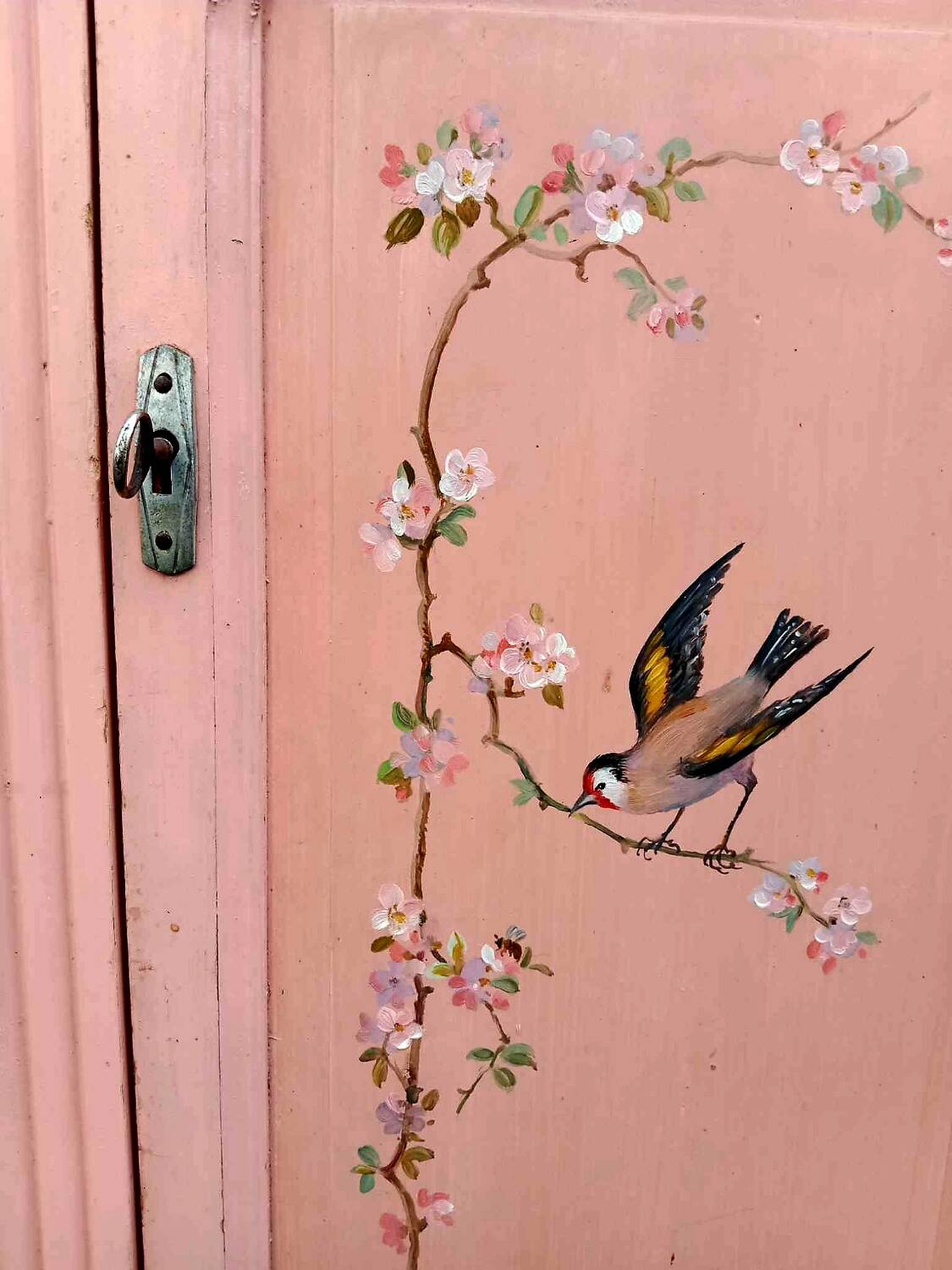 Old pink Parisian cabinet with painted decor