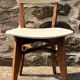 Pair of vintage chairs with upholstered backrest and seat, 1950s style.